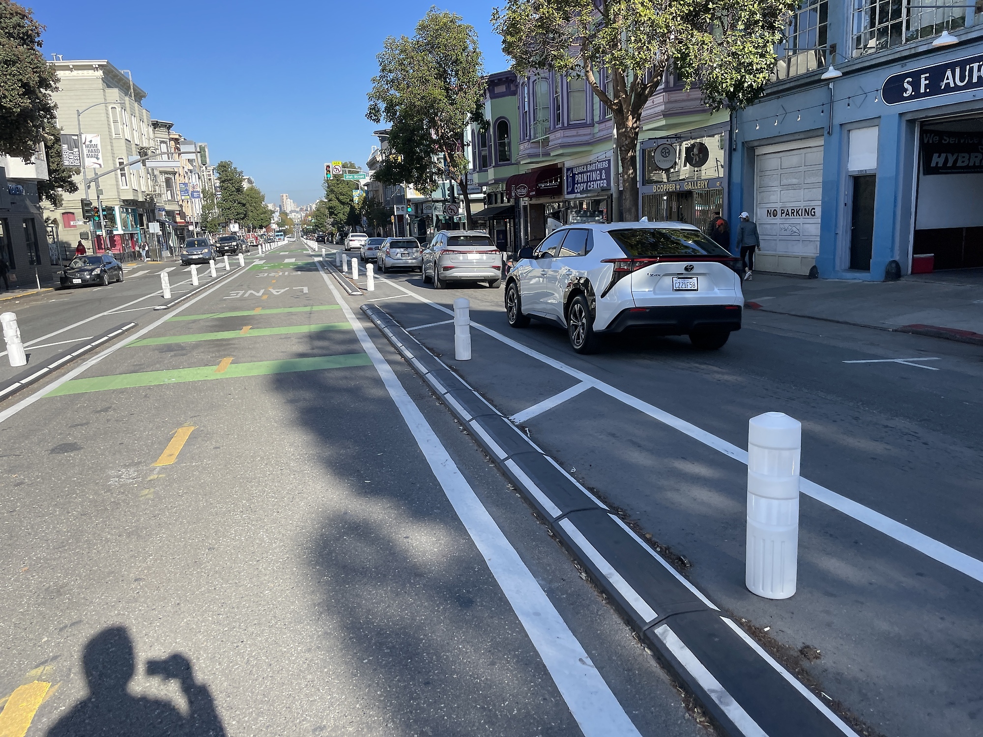 Michael enjoys the ride on the luxury bike path in the center of Valencia Street.